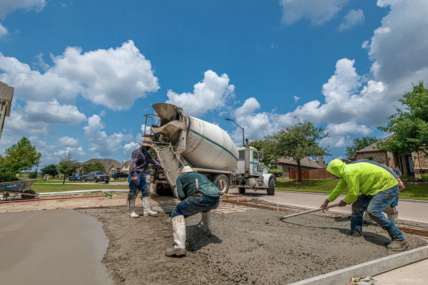 Freshly poured concrete driveway being finished — Baltimore area, MD.