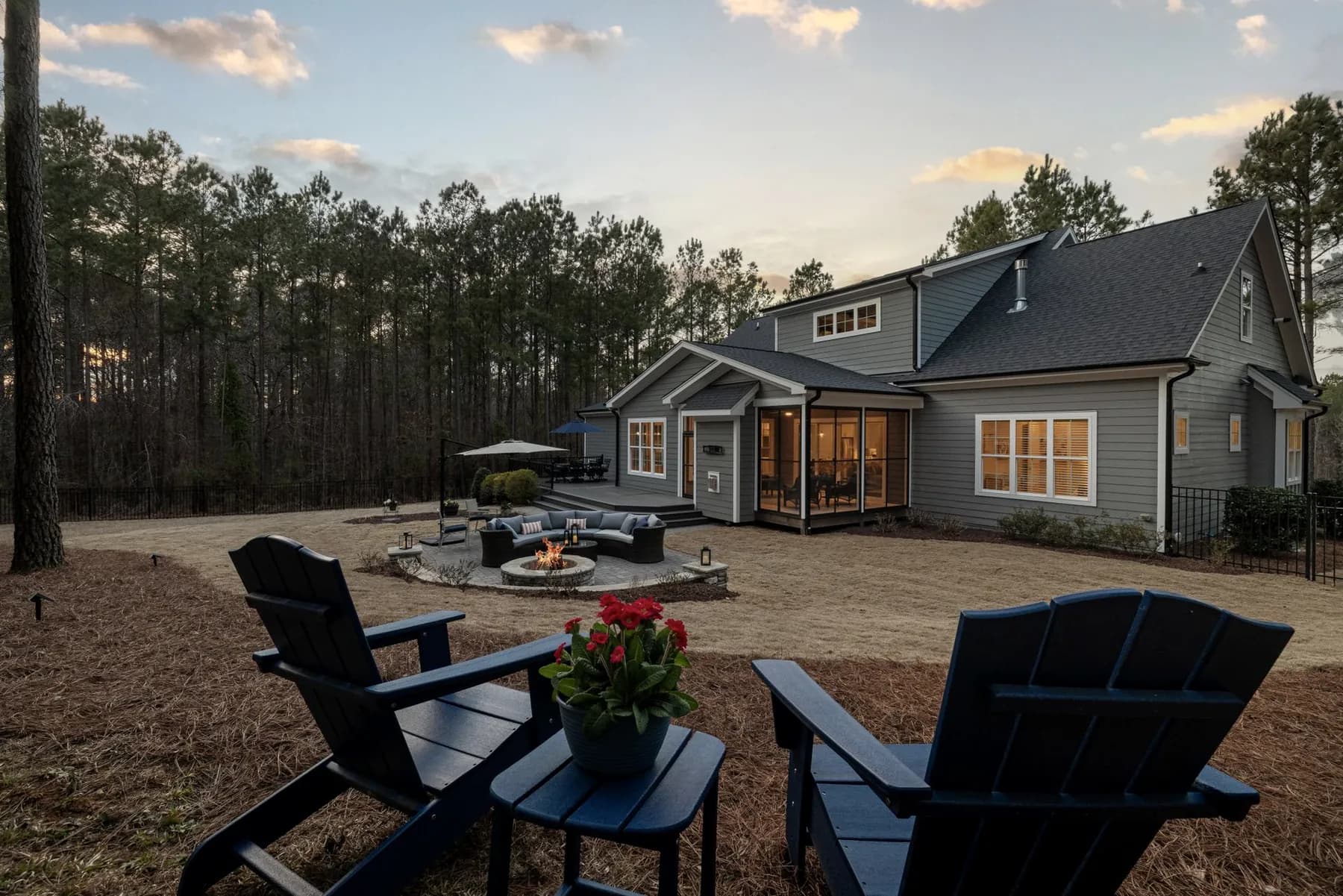 Backyard fire feature and patio seating at dusk — Baltimore area, MD.