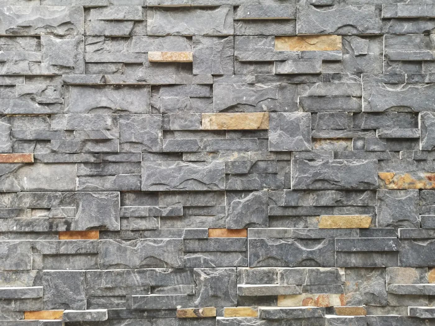 Stacked natural-stone veneer facing on an exterior wall — Baltimore area, MD.