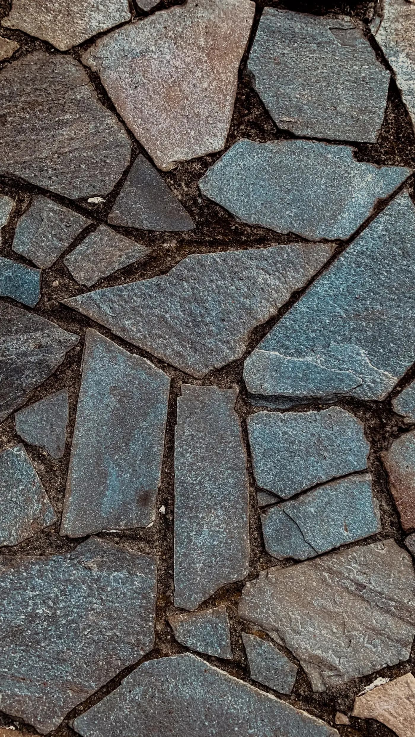 Close-up of bluestone flagstone with tight mortar joints.