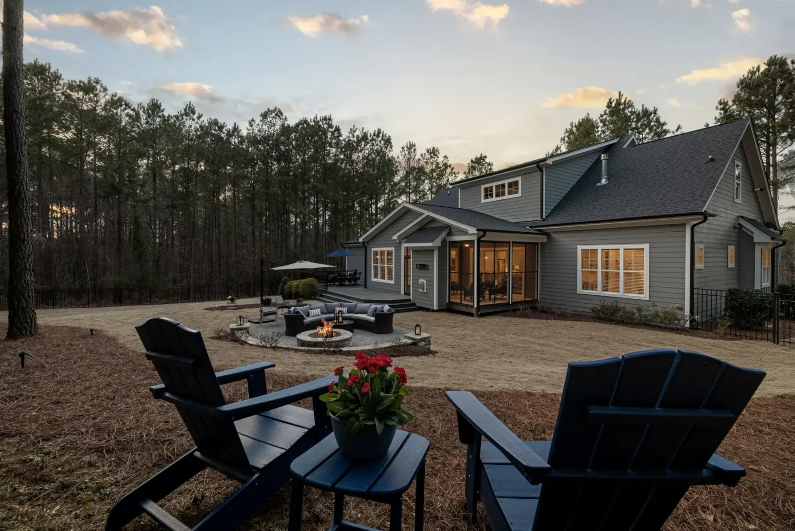 Backyard fire feature and patio seating at dusk — Baltimore area, MD.
